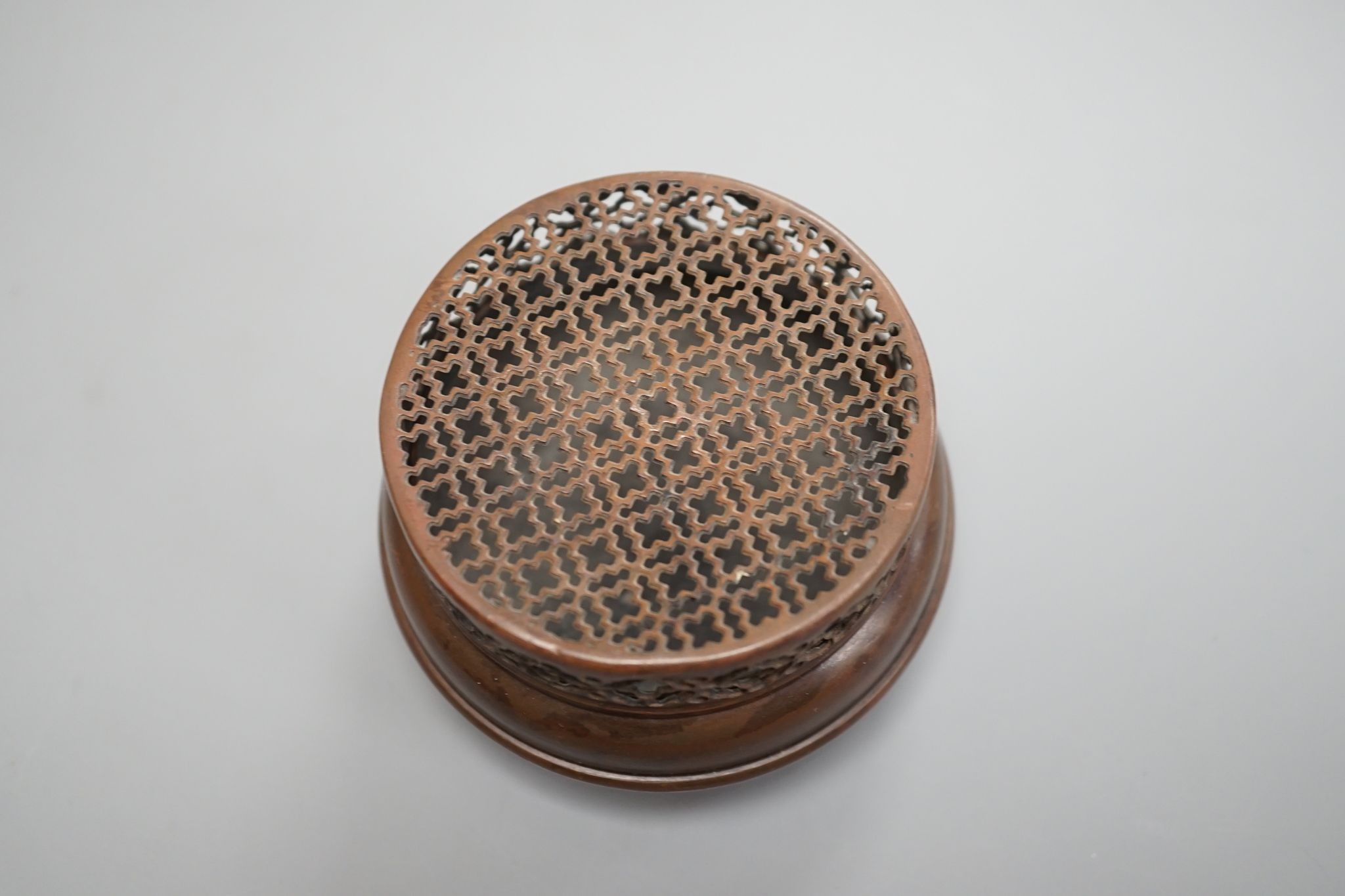 A Chinese bronze hand warmer, signed Zhang Mingqi 8cm diameter